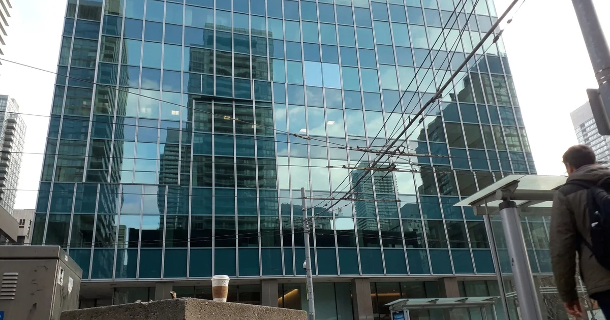 Bay Street office facade with a replaced curtain wall unit matching its neighbours