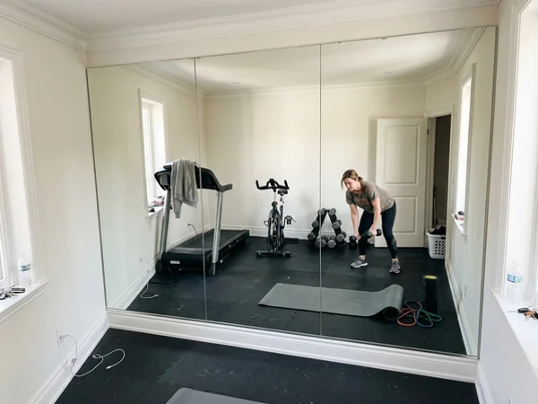 Full-height gym mirror wall in an Old Oakville home