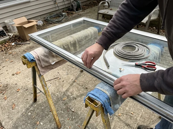 New pile weatherstrip going into a sliding door interlock