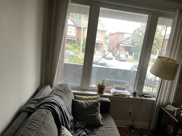 Stress crack across a living room window pane in Riverdale